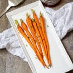 Roasted Carrots on white serving dish.