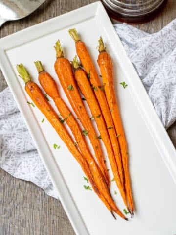 Roasted Carrots on white serving dish.