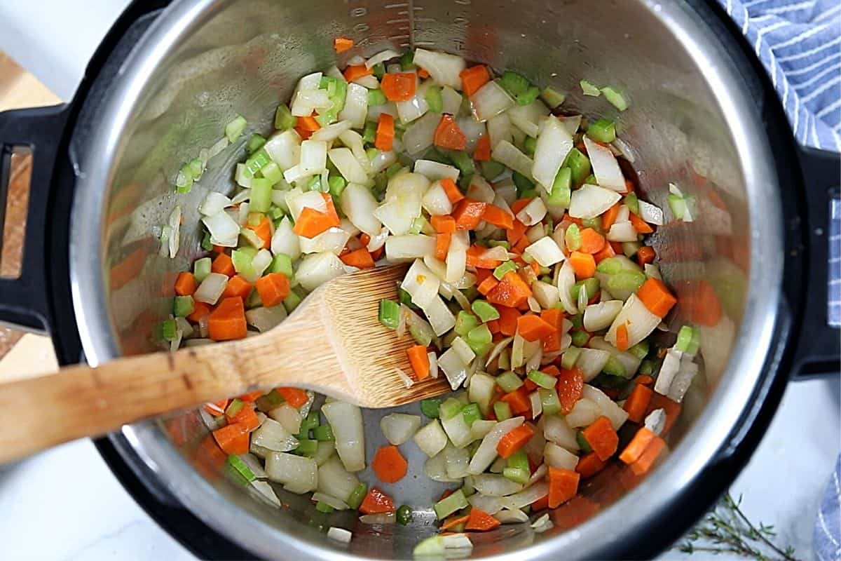 Onions, celery, carrots, and garlic in inner pot. 
