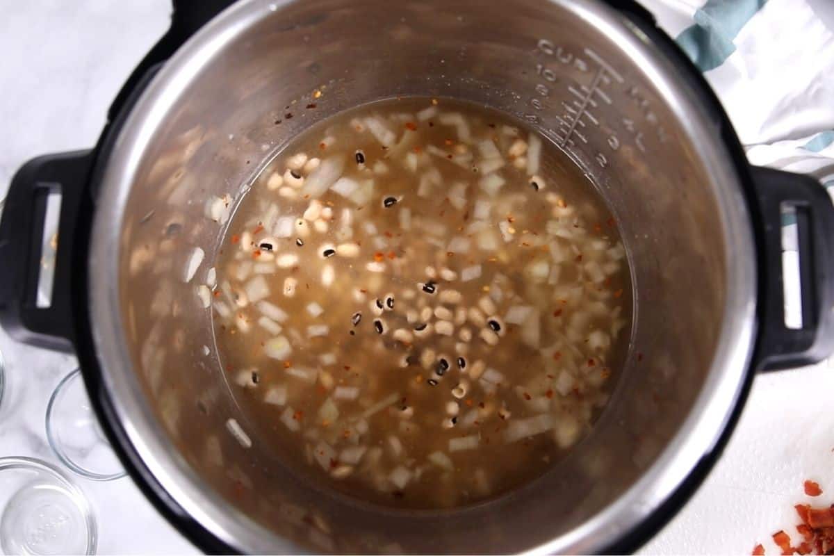Instant Pot with stock and dried black eyed peas.