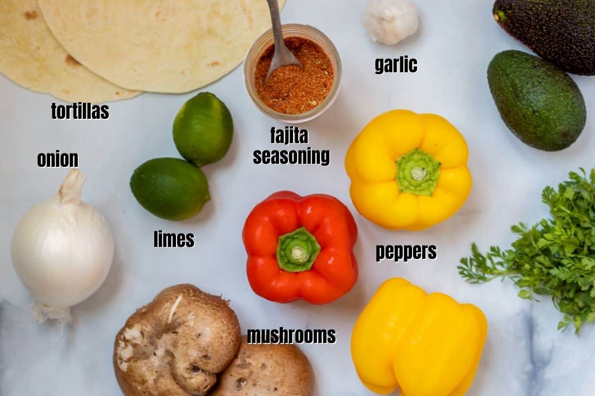 Ingredients for veggie fajitas labeled on counter.