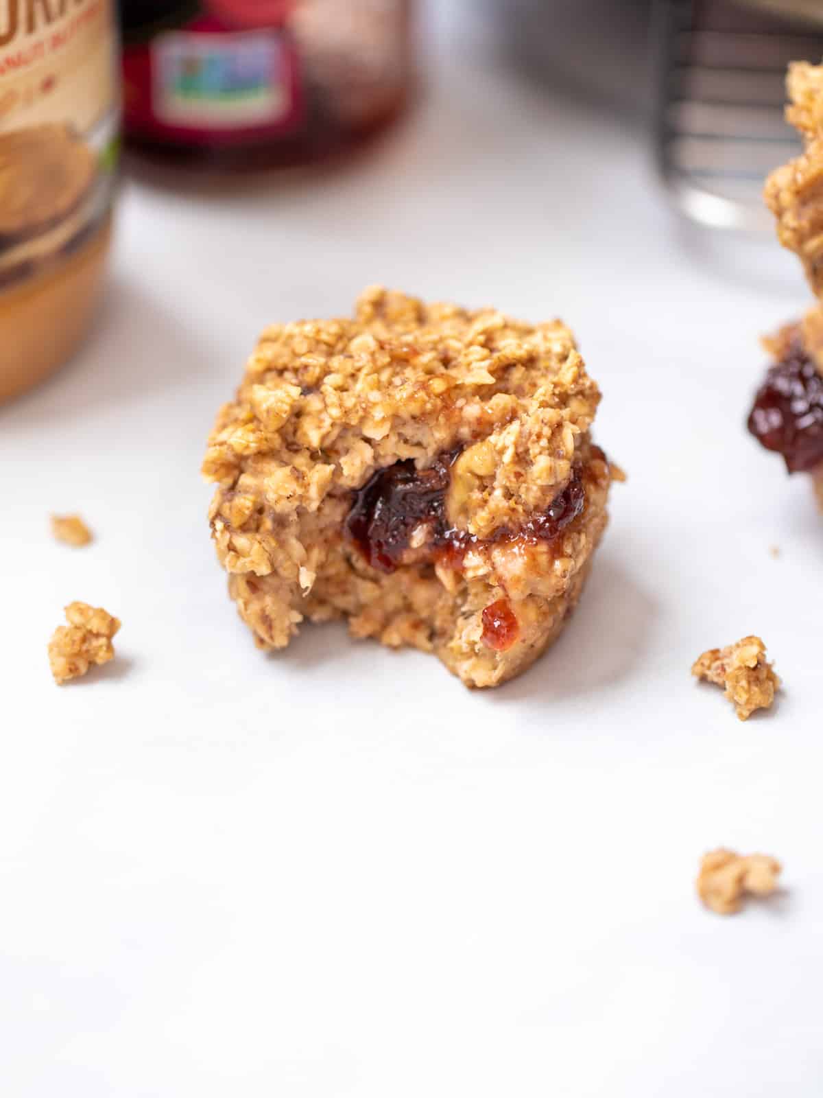 Baked Oatmeal Cup showing jelly coming out of center of muffin.
