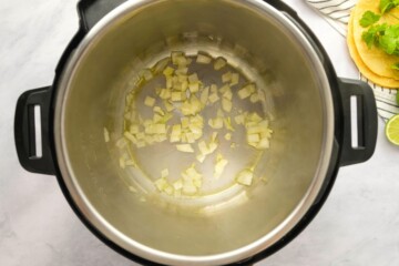 Sauteed onion in oil in inner pot.