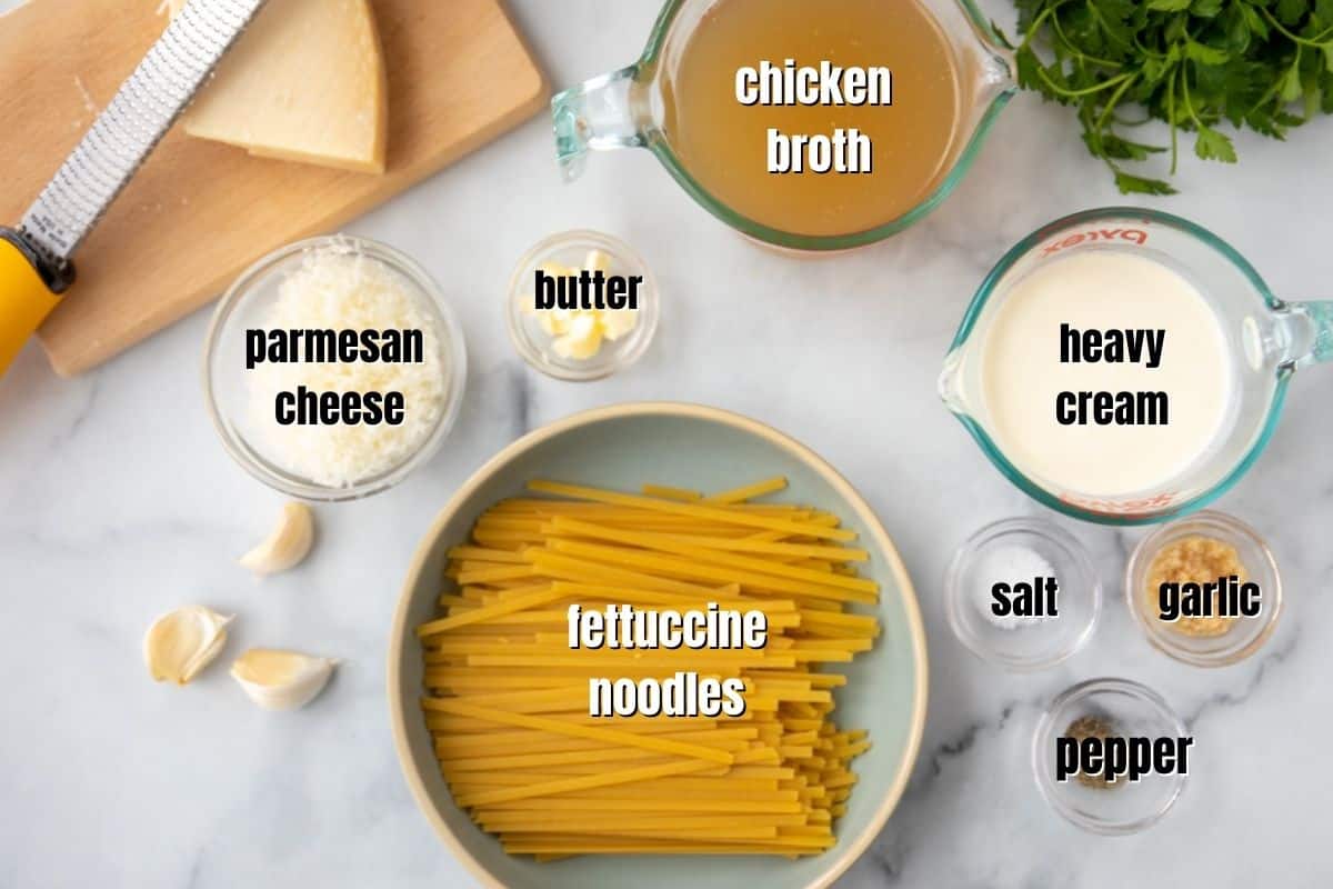 Ingredients for Instant Pot Fettuccine Alfredo Labled on counter. 