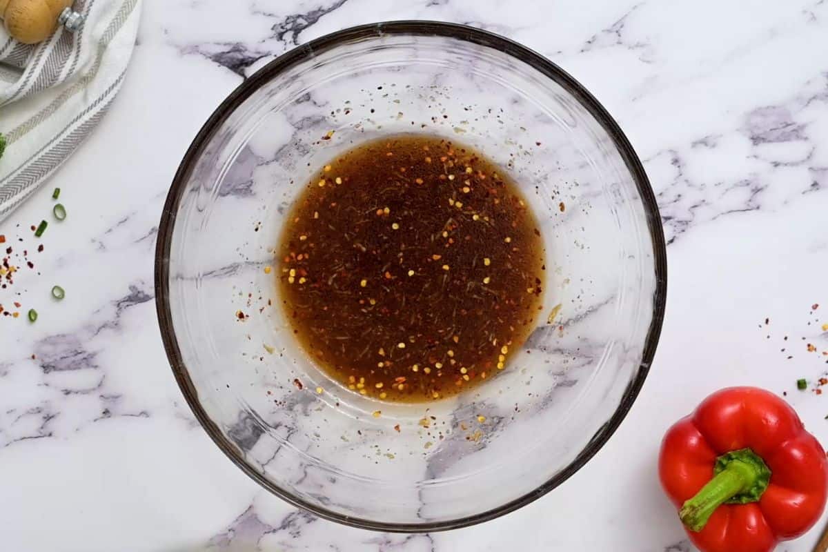 Sesame soy dressing in a small bowl.