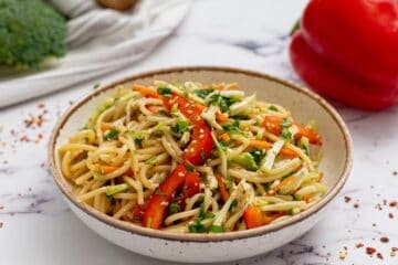 Noodle Salad in bowl topped with sesame seeds.