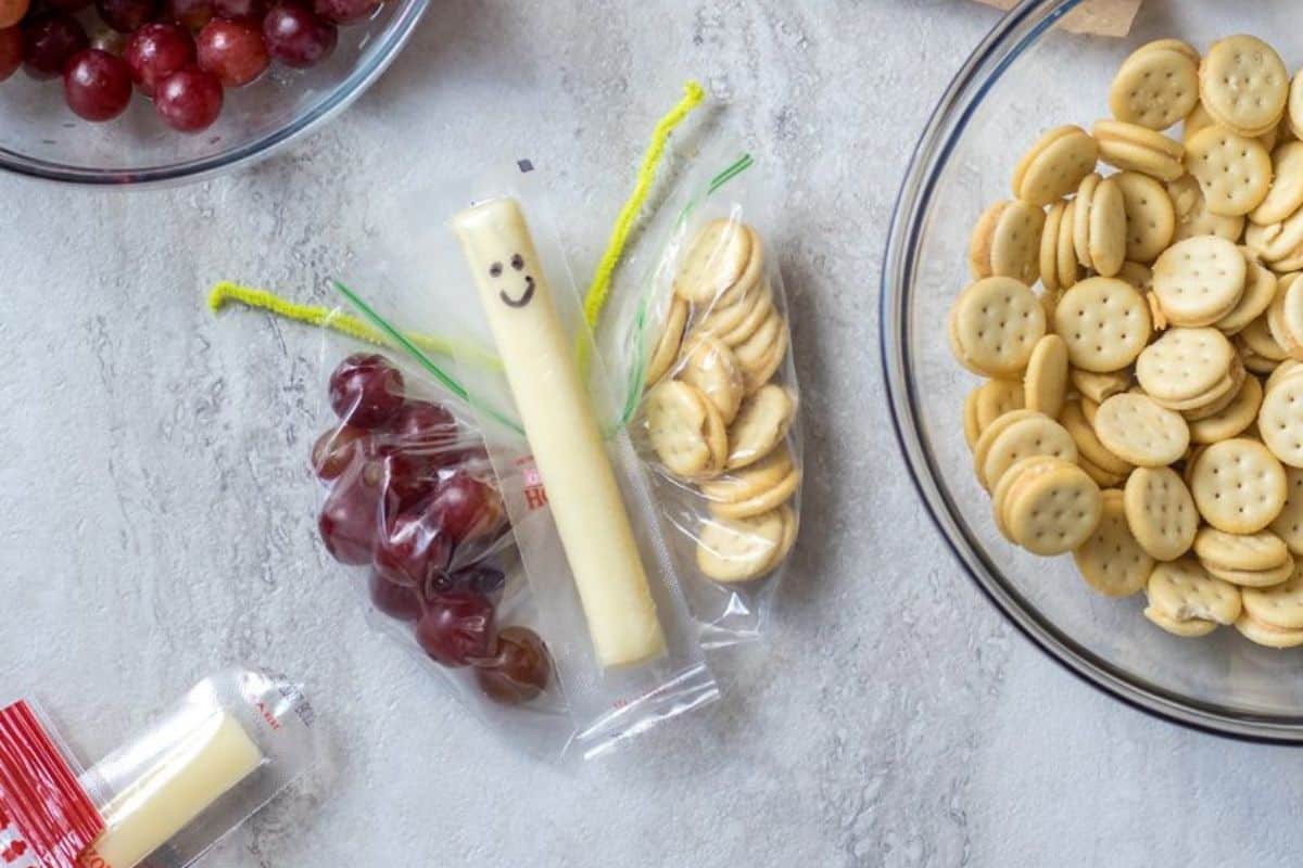 Snack Bag filled with mini crackers, grapes, and a cheese stick to look like Butterfly.