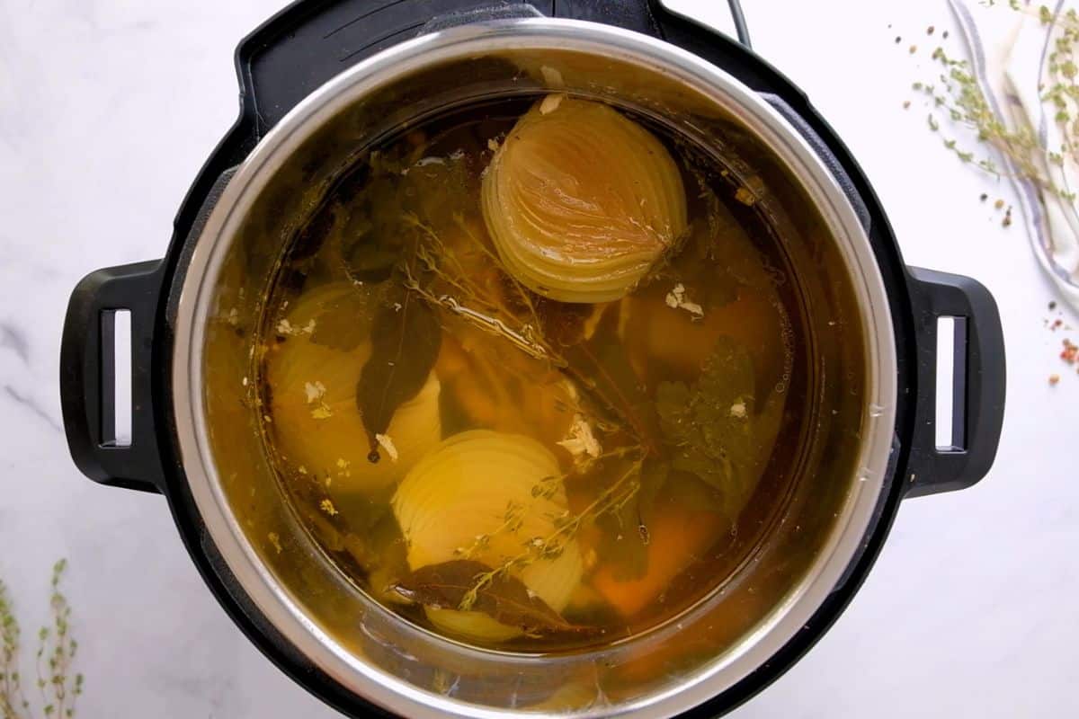 Broth inside the inner pot before straining and after pressure cooking.