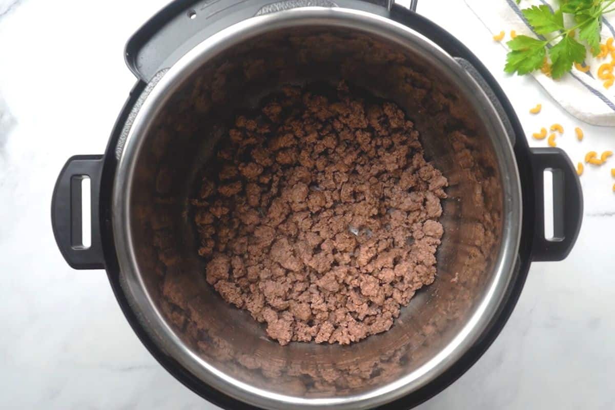 Browned ground beef inside inner pot.