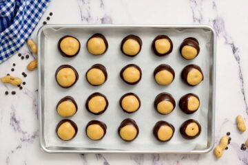 Peanut Butter Balls dipped halfway into chocolate to resemble buckeyes.