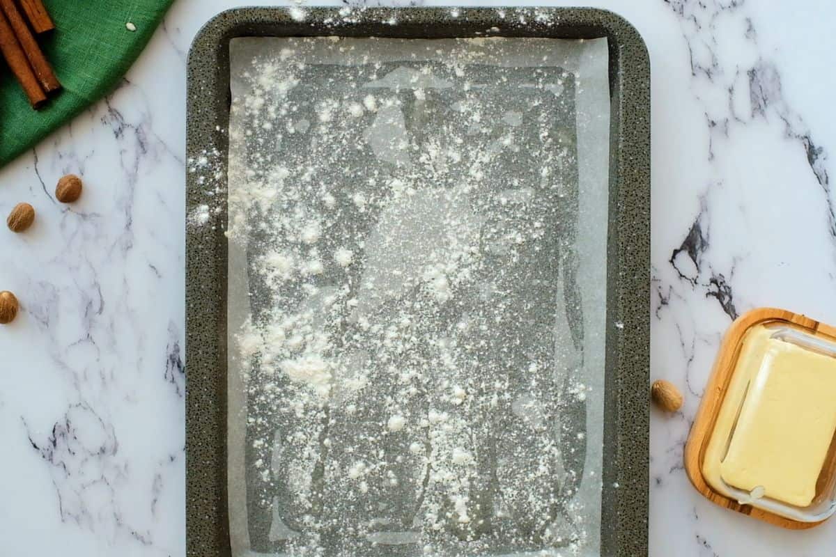 Sheet pan lined with parchment paper and dusted with flour.