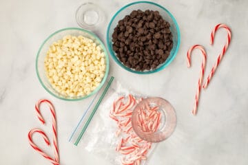 Baggie of crushed candy canes next to ingredients for Peppermint Bark
