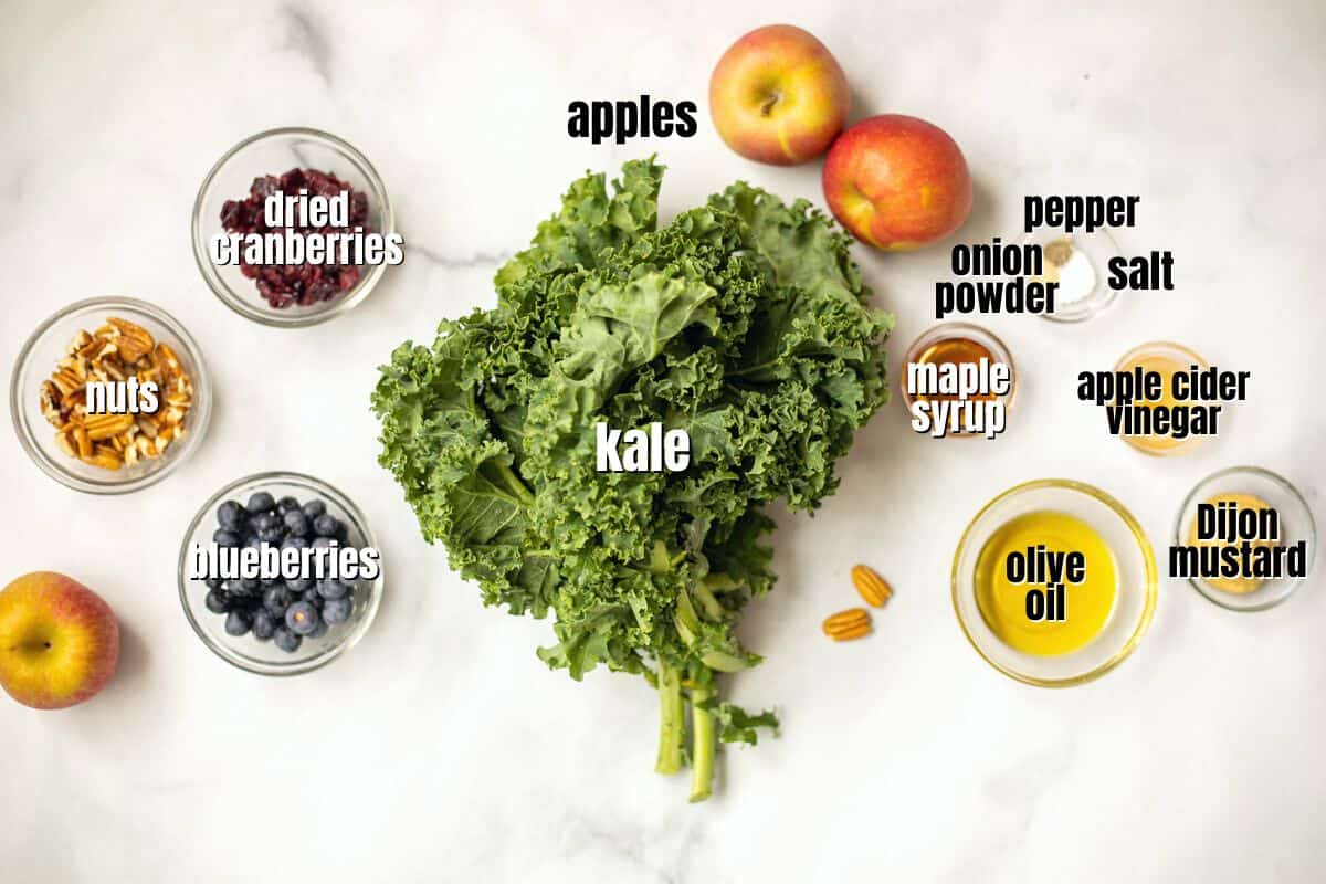 Ingredients for kale salad labeled on counter.