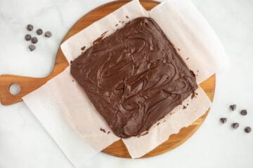 Fudge on parchment paper before cutting into slices.