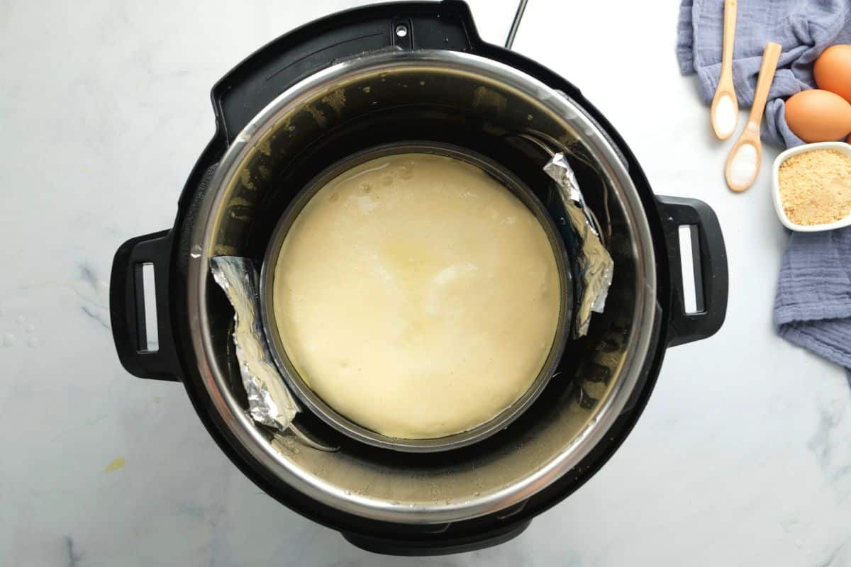 Baked Cheesecake inside inner pot of pressure cooker.