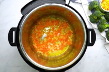 Sauteed carrots and onions in butter in the inner pot.