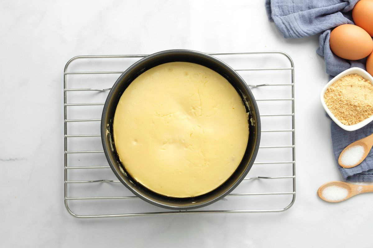 Baked Cheesecake on cooling rack.