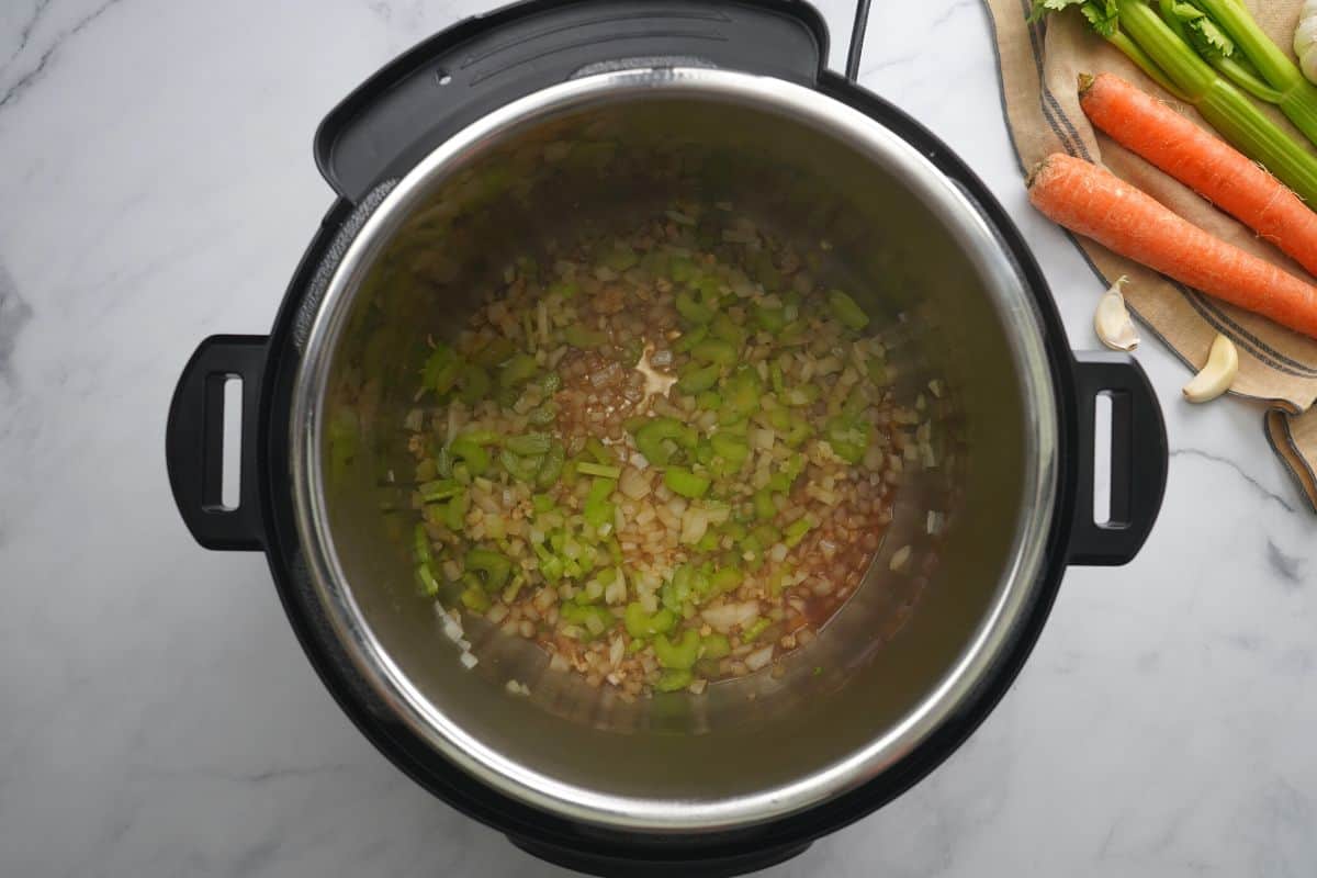 Wine added to inner pot after sauteeing celery and onions in inner pot.