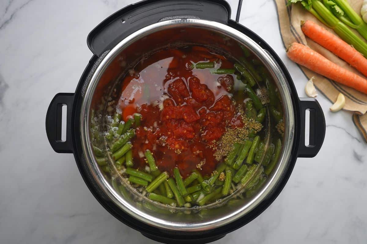 Pressure cooked vegetable soup inside inner pot.