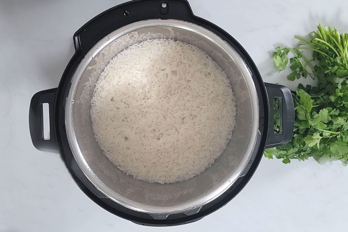 Perfectly cooked white rice inside inner pot of instant pot.