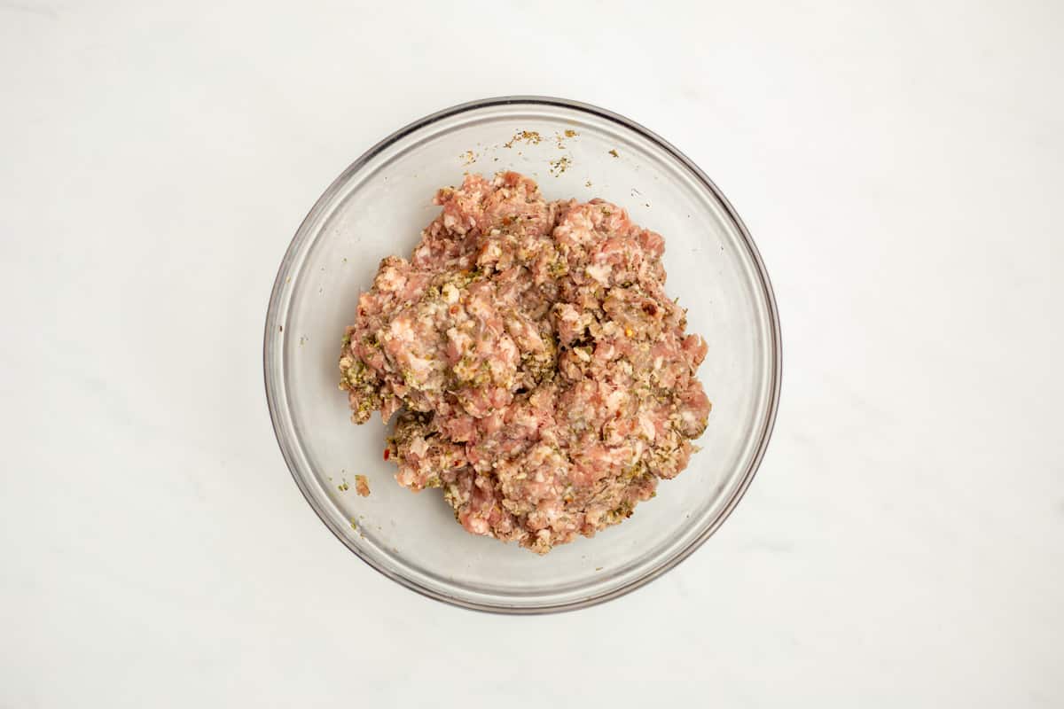 Ground Pork mixed with spices to make Italian sausage.