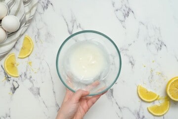 Bowl with lemon powdered sugar glaze.