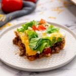 Slice of Mexican Lasagna on plate.