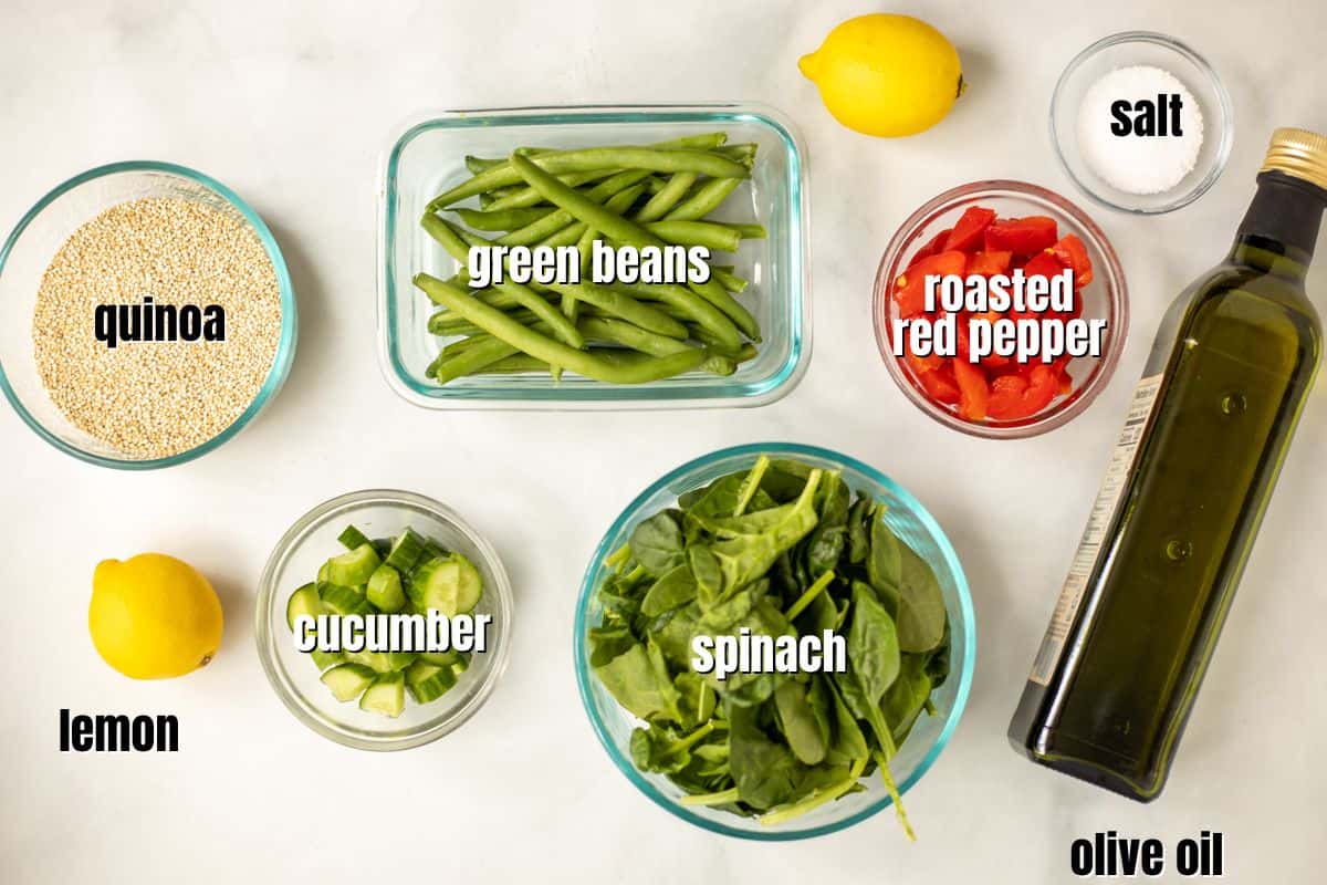 Ingredients for Spinach Quinoa Salad are labeled on the counter.