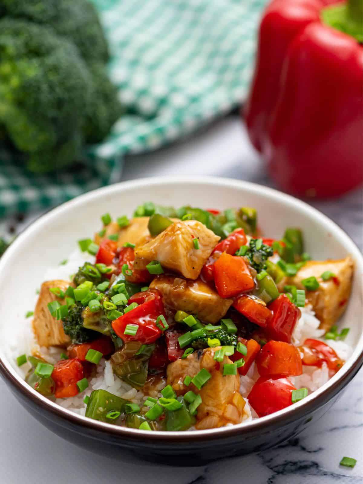 Bowl of Hunan Chicken served over rice.