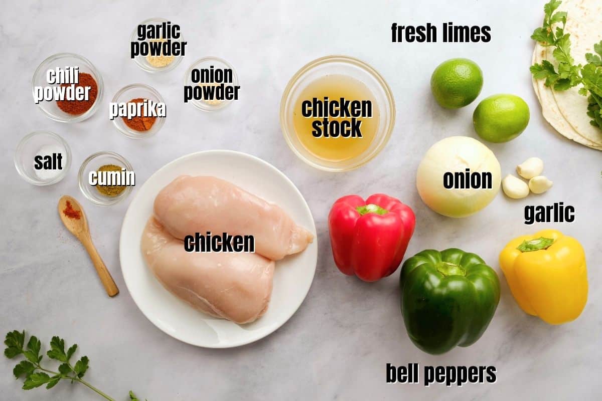 Ingredients for Instant Pot Chicken fajitas on countered labeled with text.