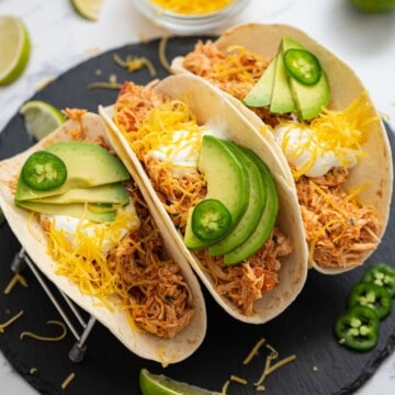 Shredded Mexican Chicken served on three flour tortillas, topped with shredded cheese, avocado, and sour cream.