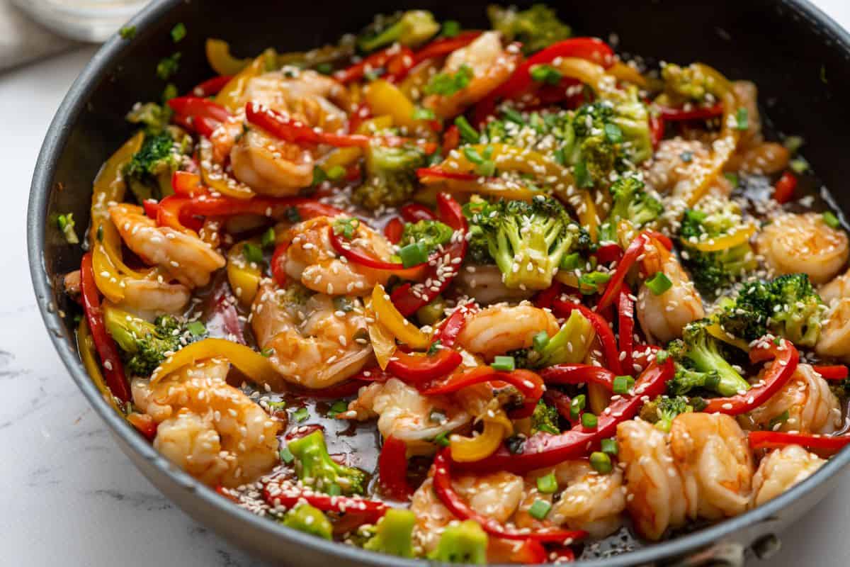 Fish Recipes for Kids Skillet showing shrimp stir fry with veggies and stir fry sauce.