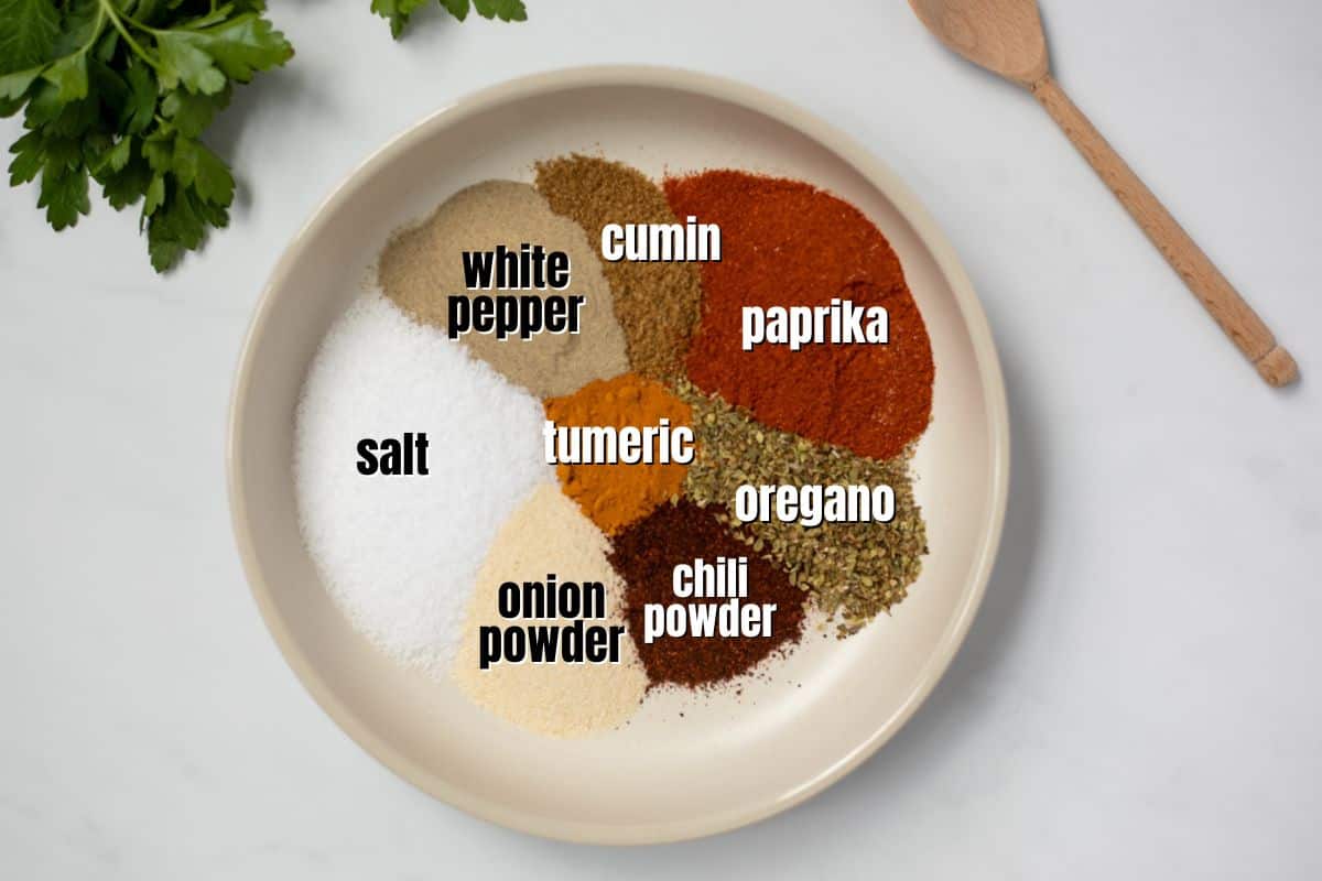 Ingredients for Goya Seasoning labeled in small bowl.