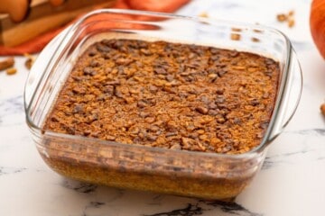 Baked Pumpkin oatmeal in glass baking dish on counter.