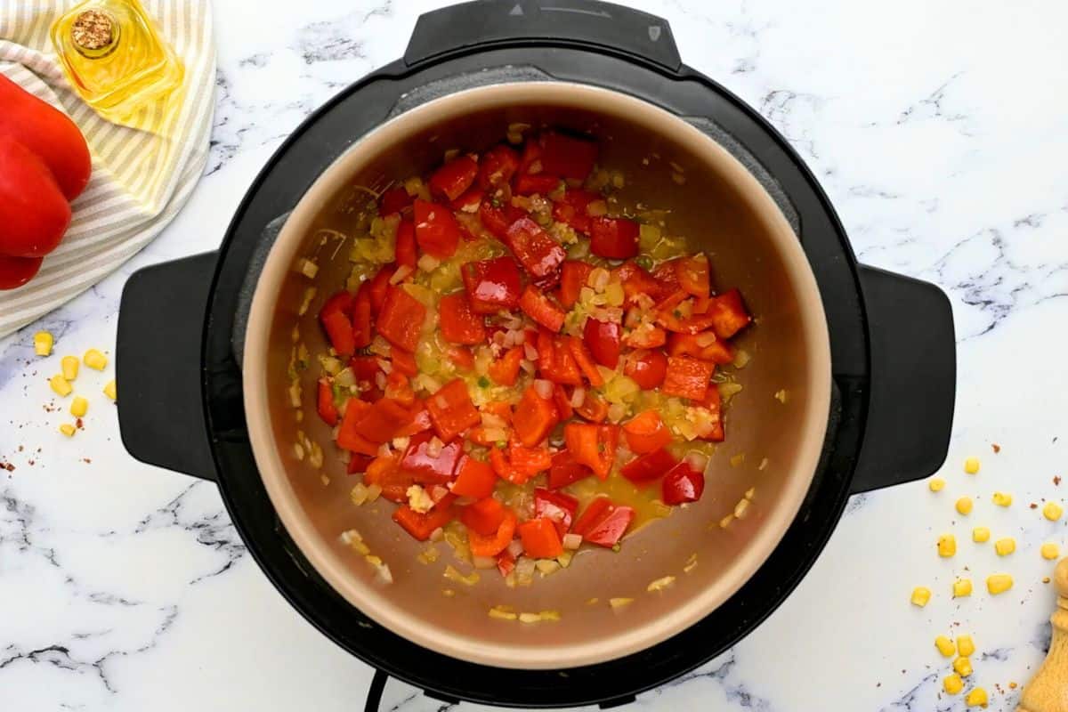 Red bell pepper, and onions sauteed together in inner pot.