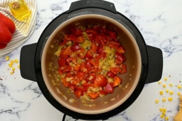 Sauteed peppers, onions, and jalapeno inside inner pot of instant pot.