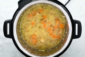 Cooked Chicken Orzo soup inside inner pot.