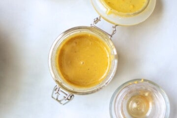 Champagne Vinaigrette in small glass mixing jar with lid.
