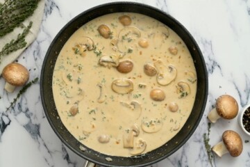 Marsala sauce with cream in skillet.