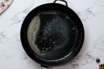 Melted butter in large cast iron skillet.