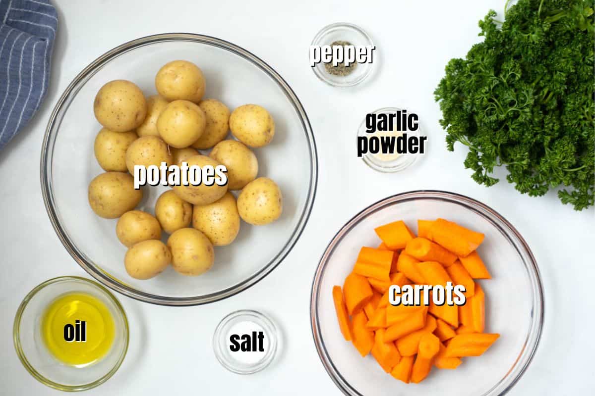 Ingredients for Roasted Potatoes and Carrots labeled on counter.