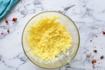 Mixing bowl with creamed butter and granulated sugar.