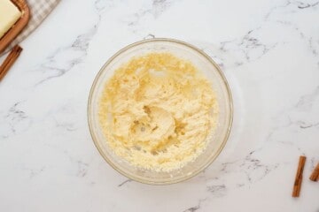 Creamed ingredients for snickerdoodle cookies in large mixing bowl.
