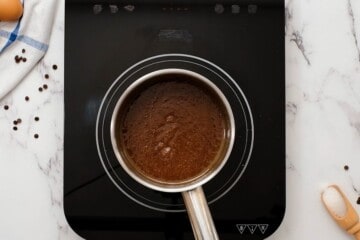 Butter, espresso powder, and sugar in saucepan.