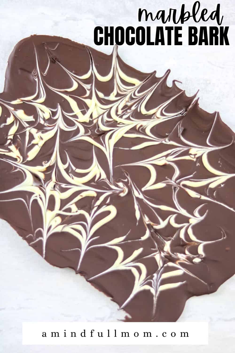 Make gourmet homemade chocolate bark using this simple recipe! It makes a delicious gift, or no-bake treat to enjoy yourself. Enjoy this simple marbled chocolate bark plain or follow given variations to make homemade chocolate bark the way you like!