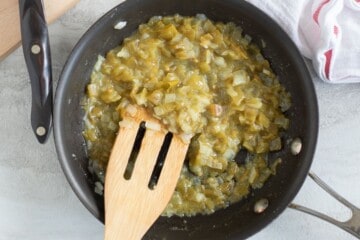 Green Chiles and yellow onion sauteed in small saute pan.