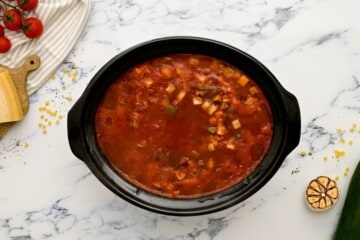 Slow Cooker with ingredients for minestrone after cooking but before adding pasta.