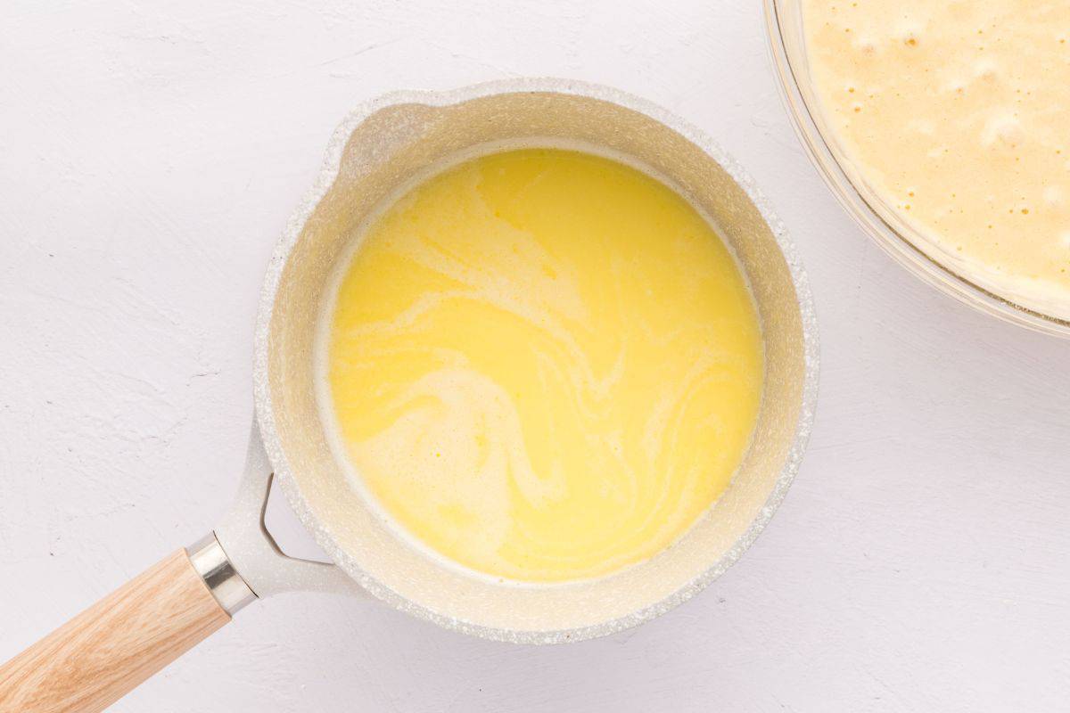 Saucepan with milk and melted butter.