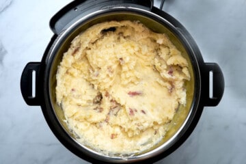 Mashed red potatoes inside inner pot of pressure cooker.