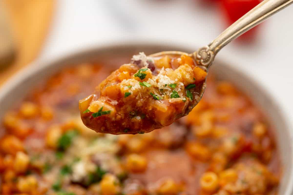 Spoonful of Instant Pot pasta fagioli with parmesan.
